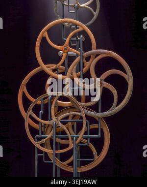 Kinetic Wooden Gear Sculpture with Rusty Finished Wheels Stock Photo