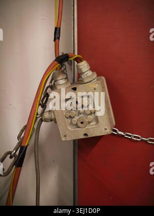 Exposed Junction Box With Colorful Wires, Closeup Showing Conduit Entry, Chained Mounting, Multicolor Cable Stock Photo