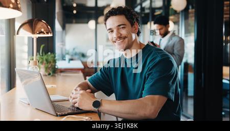 Laptop, happy and portrait of man in coffee shop with remote work for software development. Smile, cafe and full stack engineer with computer for Stock Photo
