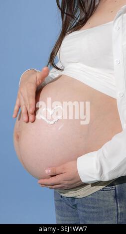 Close up of a drawing on a pregnant belly Stock Photo