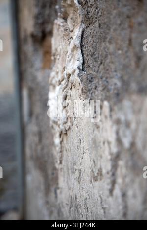Surface with layered mortar and subtle earthy tones suggesting decay Stock Photo