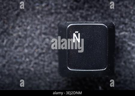 Close-up of a key from an old computer keyboard with the special letter for the Spanish language Stock Photo