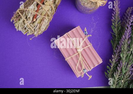 Making soap with herbs and lavender on a purple background Stock Photo