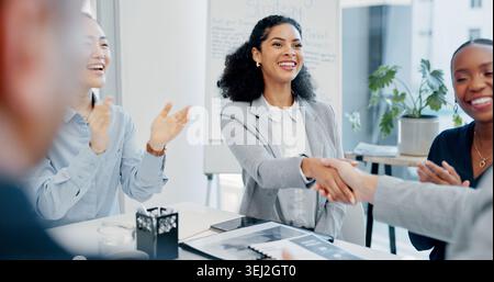 Shaking hands, applause and business people in office for meeting with finance deal, partnership or agreement. Happy, clapping and financial manager Stock Photo