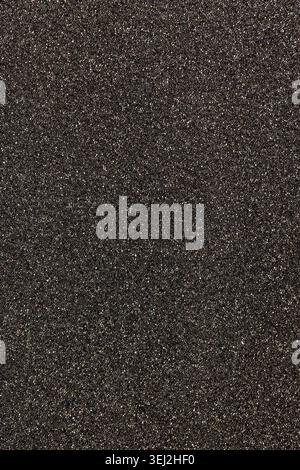 soft black foam rubber with a large number of small holes to ensure sound insulation , soft foam rubber that can be used for different areas of work, Stock Photo