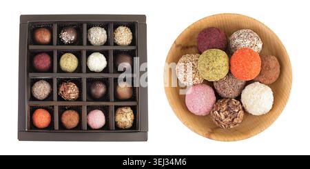 A variety of different truffles in a box and wooden bowl Isolated on a white background. Top view. Flat lay. Stock Photo