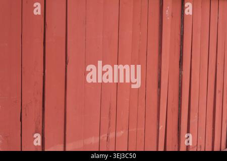 BACKGROUND TEXTURE OF A RED WOODEN FENCE Stock Photo