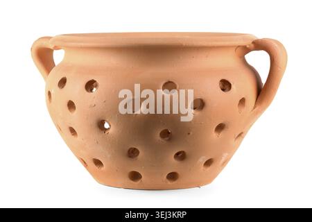 Traditional portuguese ceramic pot with holes for baking chestnuts isolated on white background Stock Photo