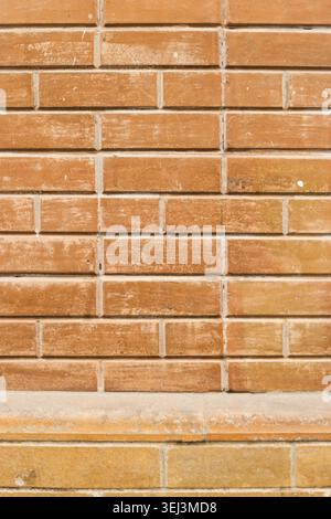 Weathered stained old brick wall background Stock Photo