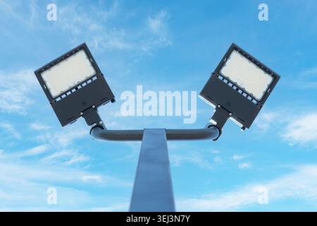 Low Angle View Of Modern LED Street Lamps Against Blue Sky Stock Photo