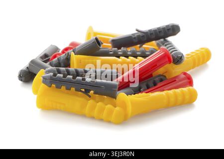 Closeup of colorful plastic dowels isolated on white background Stock Photo