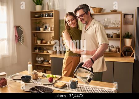 Adult Couple Preparing Breakfast Together at Home Kitchen Stock Photo