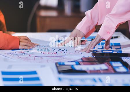 team of UI UX web designer are working together to develop mobile responsive websites with UI UX front end designer previews Stock Photo
