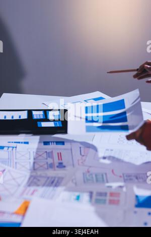 team of UI UX web designer are working together to develop mobile responsive websites with UI UX front end designer previews Stock Photo