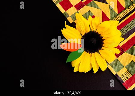 Sunflower with kente cloth celebrating african heritage and pride Stock Photo