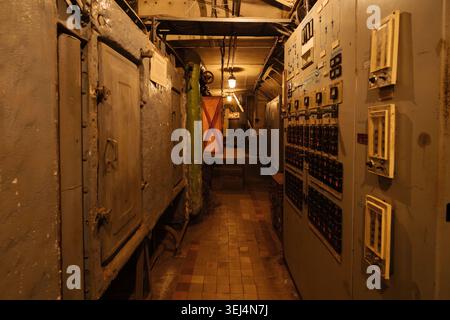 Underground military bunker, bomb shelter, protective construction of civil defense, electrical switch gear and ventilation pipes. Stock Photo