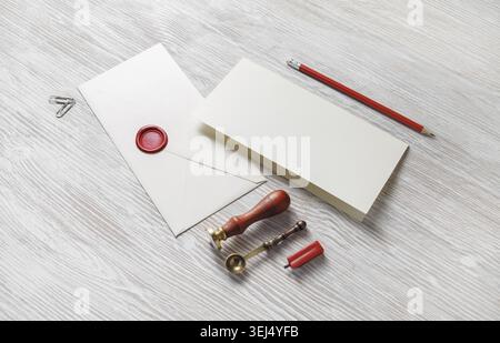 Vintage envelope and stationery on light wooden background. Responsive design mockup Stock Photo