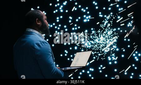 Computer scientist monitoring AI model cognitive systems using AR projection interface. RD tech startup IT expert using augmented reality visualization to study neural network nodes activity, camera B Stock Photo