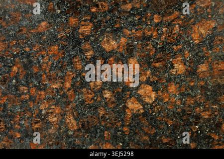 Polished Red and Black Granite Stone Texture Stock Photo