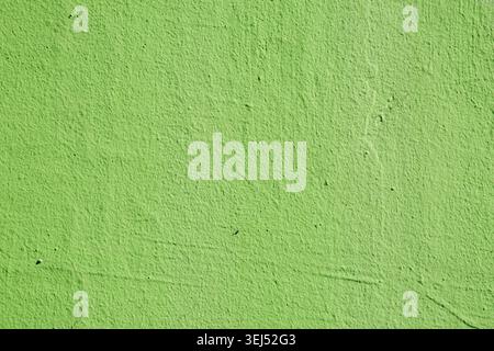 Bright Green Textured Stucco Wall Surface Stock Photo