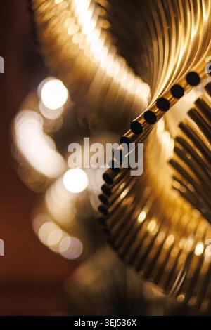 Abstract Golden Curved Metal Tubes Stock Photo