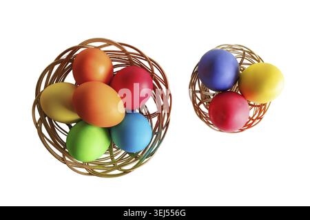 Easter eggs in two wicker baskets. White background. Top view Stock Photo