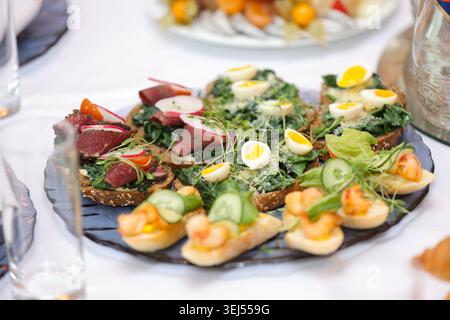 Assorted Gourmet Bruschetta and Canapes on Platter Stock Photo