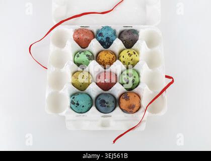 Easter eggs. Colored painted quail eggs in a cardboard box Stock Photo