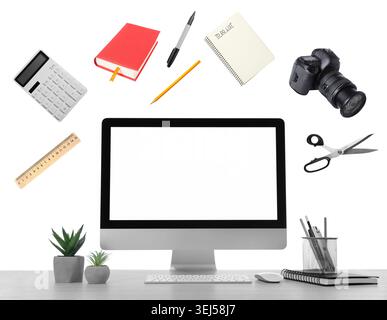 Web design tools flying around computer. Creative designer workspace Stock Photo
