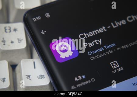 Dhaka, Bangladesh 26 Dec 2025:chamet live video chat and meet app on google play store opened in mobile phone with white surface background and copy s Stock Photo