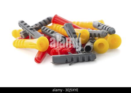Closeup of colorful plastic dowels isolated on white background Stock Photo