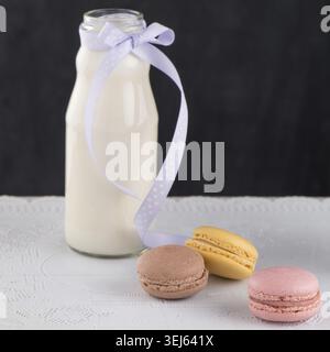 Classic Macarons with Raspberry, Coffee, Chocolate and Pistachios Filled with Cream, French Pastry Stock Photo