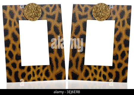 Two photo frames with leopard pattern decoration on white reflective background Stock Photo