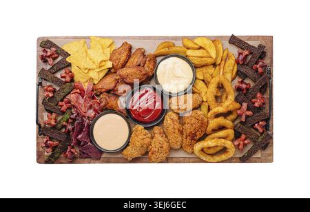 Food, A colorful platter showcases an assortment of fried snacks including chicken wings, onion rings, and tortilla chips, along with various dips. Pe Stock Photo