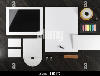 Corporate identity template on dark wooden background. Top view Stock Photo