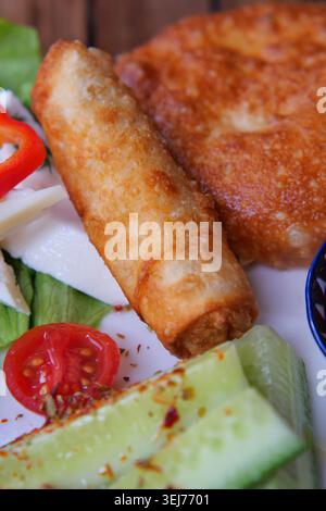 Fresh spring rolls and fried food on a plate Stock Photo