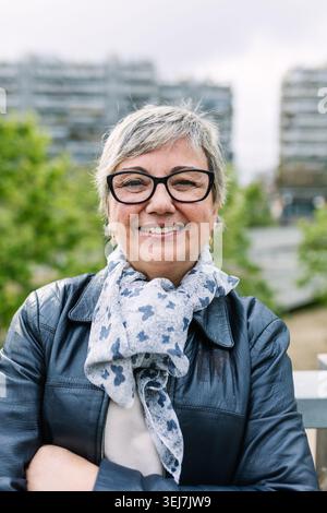 Smiling senior woman enjoying retired community life Stock Photo