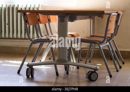 School Table And Chairs In Empty Classroom Stock Photo