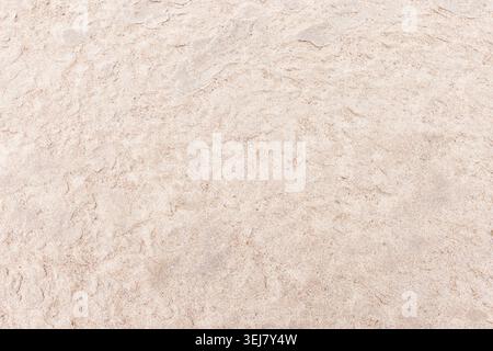 Smooth white sand beach texture with subtle ripples and fine grain, ideal as a natural background for travel, coastal and design projects that need a Stock Photo