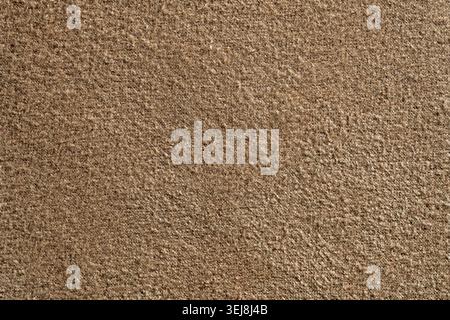 Close up of brown carpet texture or wool felt fabric. High quality seamless style background for interior design, textile industry, and commercial uph Stock Photo