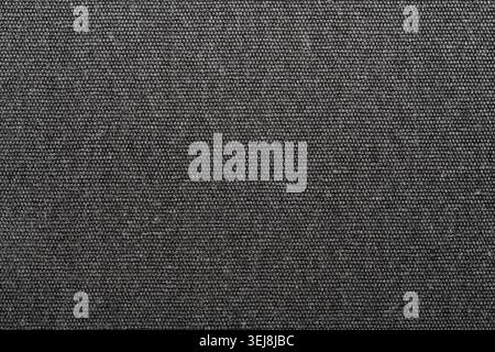 Close up of dark grey or charcoal melange textile fabric. High quality seamless style texture background for interior design upholstery and fashion ap Stock Photo