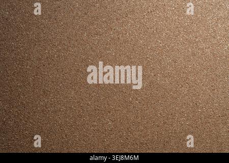 Natural cork board texture background with soft light gradient. Close up of brown corkboard textured surface with gentle light gradient for background Stock Photo
