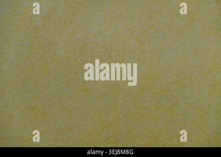 Yellow craft paper texture abstract background. Close up of textured yellow recycled paper or cardboard surface for background use Stock Photo