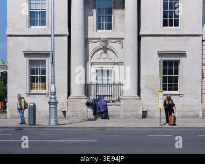 A homeless person in a sleeping bag on a street in Dublin, Ireland. Stock Photo
