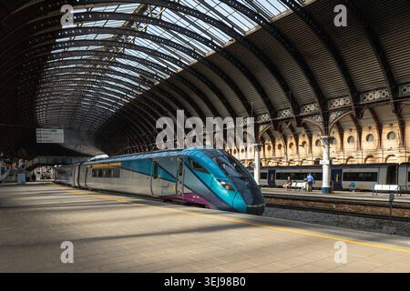 The 0730 Trans Pennine Express service from Manchester Victoria to Scarborough arrives in York railway station Stock Photo