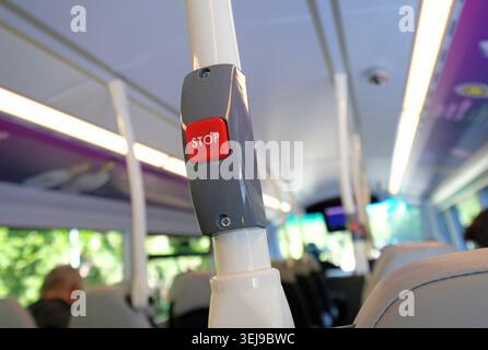 red stop button on bus, norfolk, england Stock Photo