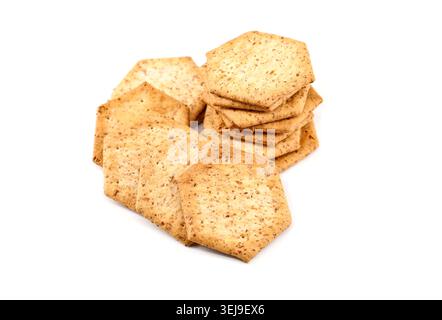 Hexagon shape organic wholemeal crackers on white background. Stock Photo