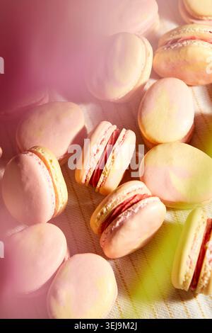Pink and Yellow Macarons Shaped Like Easter Eggs Stock Photo