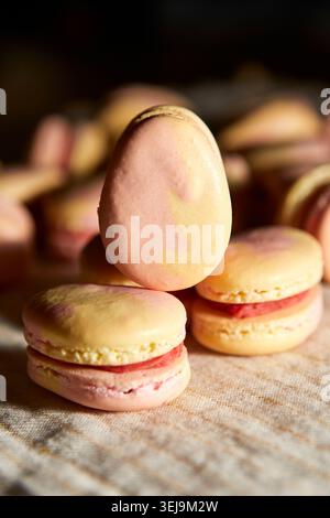 Pink and Yellow Macarons Shaped Like Easter Eggs Stock Photo