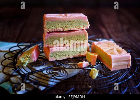 Popular viral trend, pistachio-filled Dubai chocolate bars. Dubai chocolate is a milk chocolate bar filled with a sweet pistachio-tahini cream and kad Stock Photo